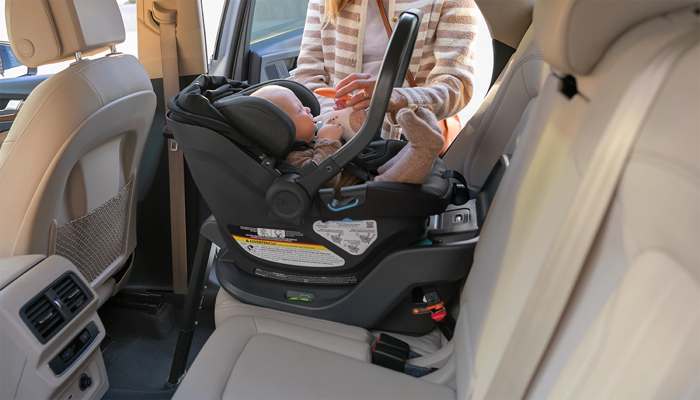 Infant in Aria car seat attached to Aria base