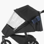 The Performance Rain Shield easily attaches to stroller frame and features reflective details for added visibility while strolling