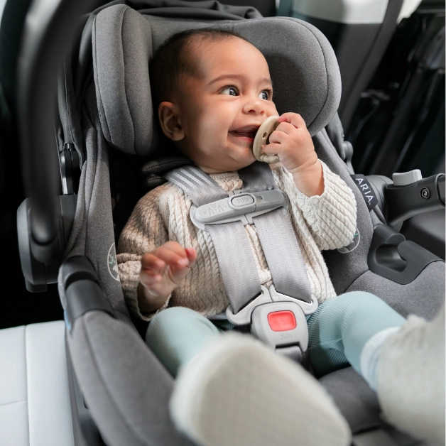 A child safe in the Aria car seat with its ajustable headrest and no-rethread, 5-point harness system to ensure a precise fit