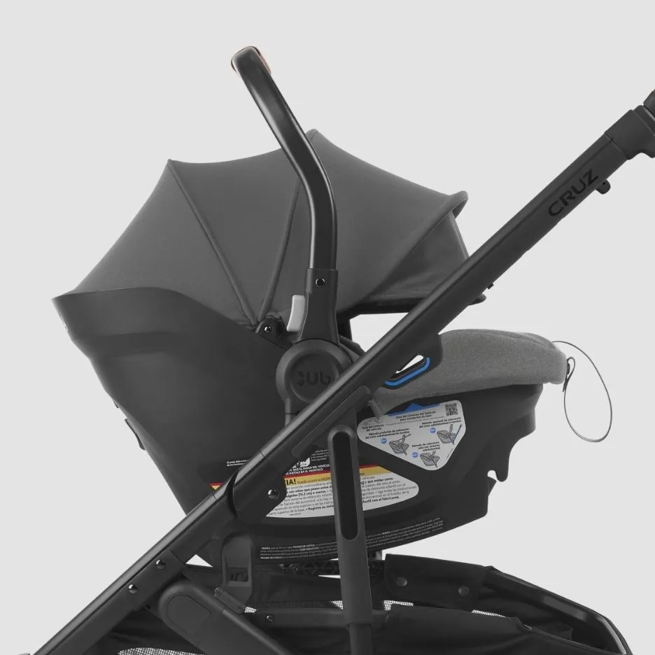 Close up of Aria infant car seat attached to Cruz V2 stroller both in Greyson