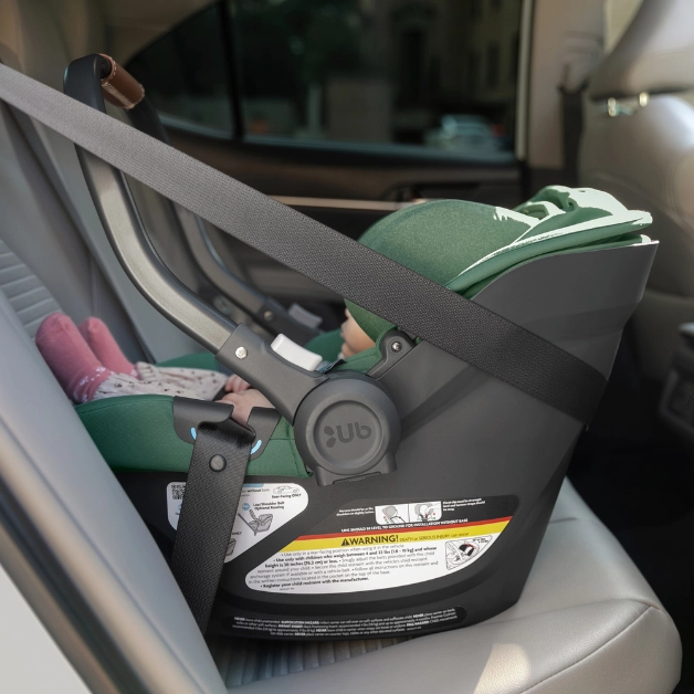 The Aria car seat installed in a ride-share vehicle with the use of European Routing and built-in lock-off for a secure seatbelt installation