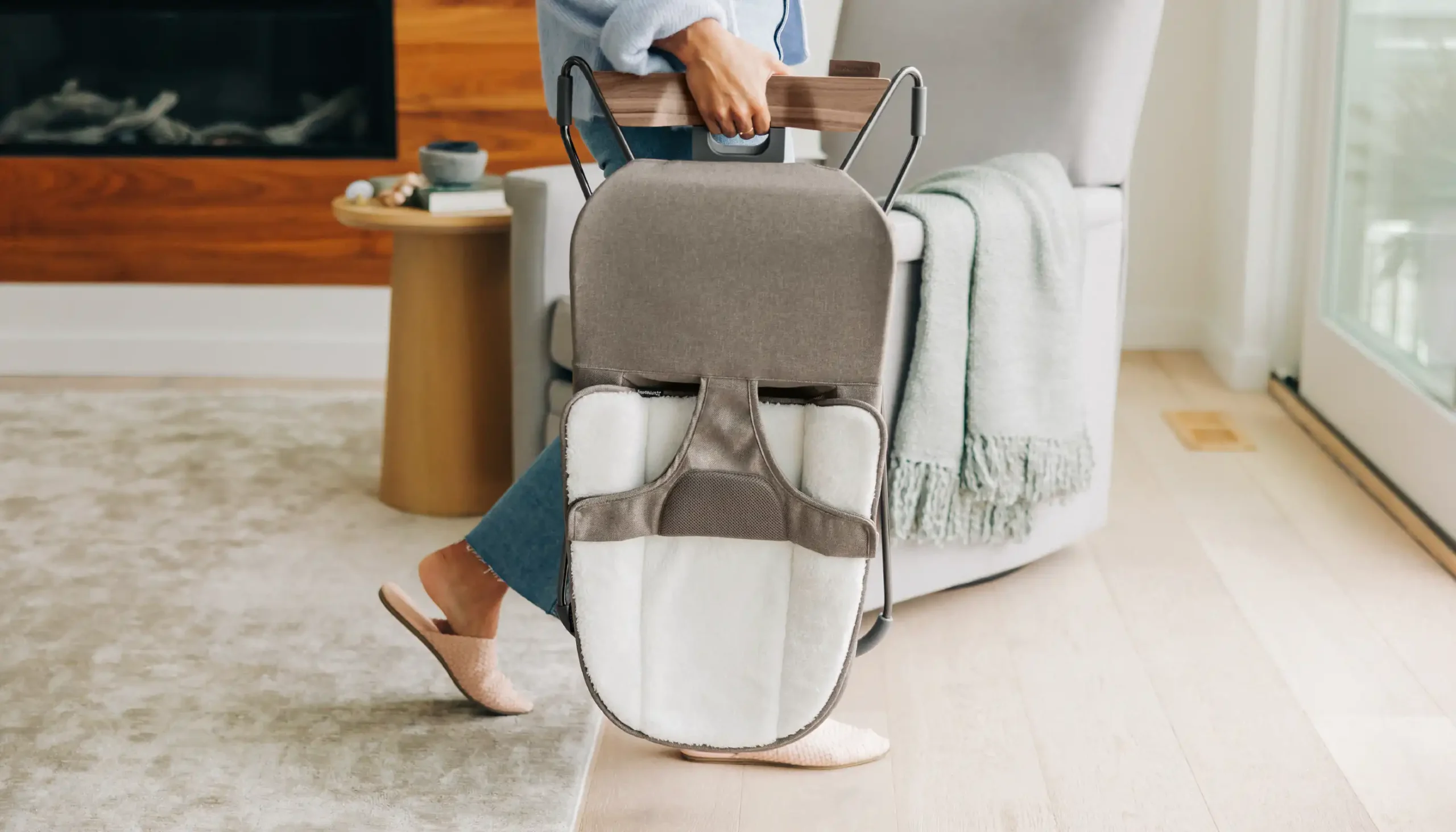 When folded flat, the Mira bouncer includes an integrated carry handle for easy transport.