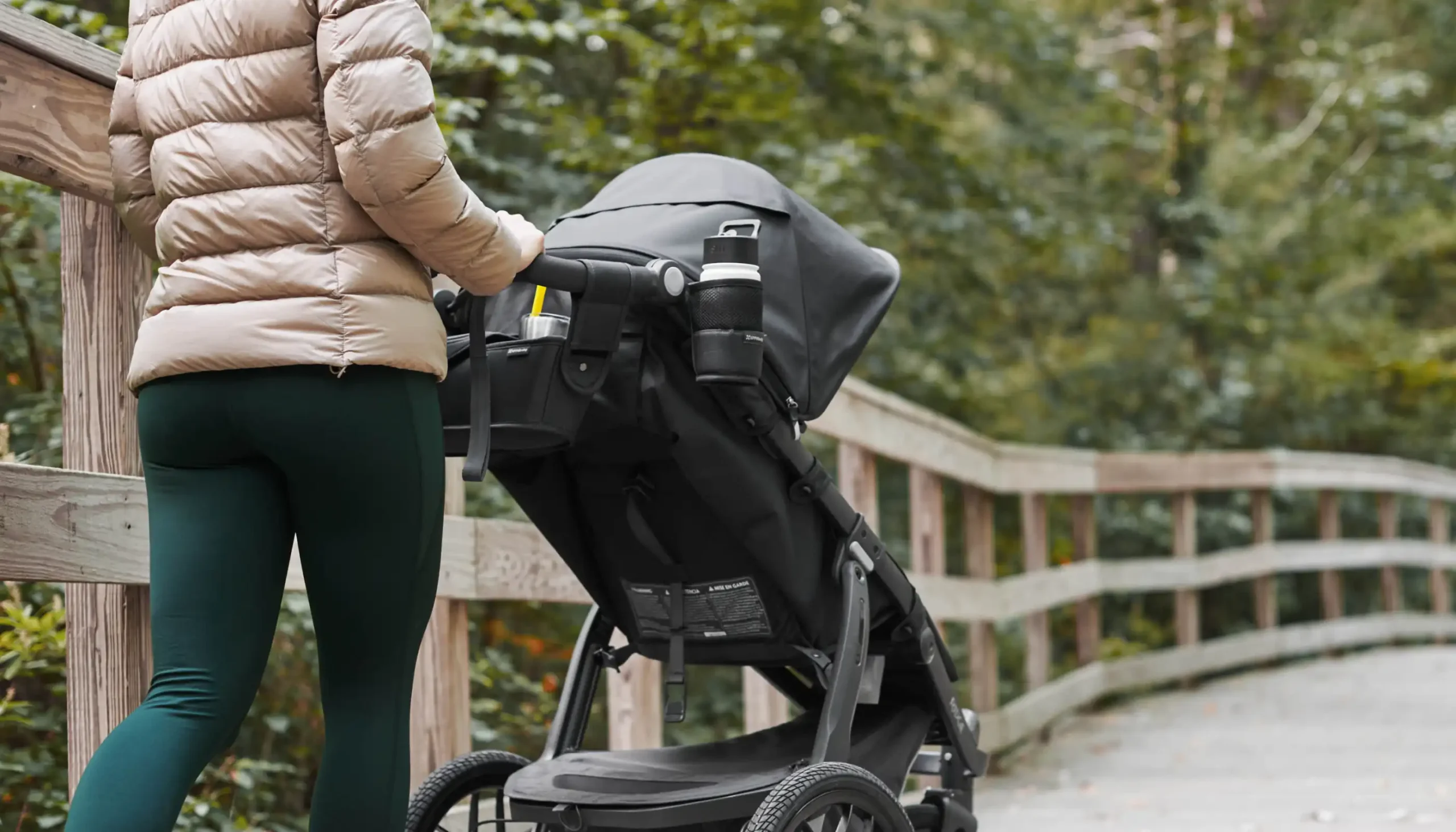 Parent pushing Ridge with bottle inside Cup Holder