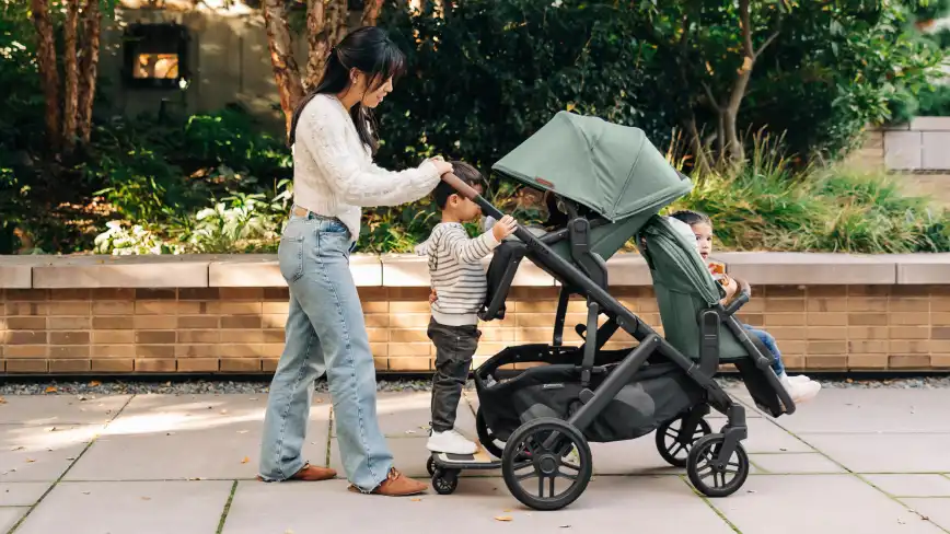 Mom strolling with child on PiggyBack