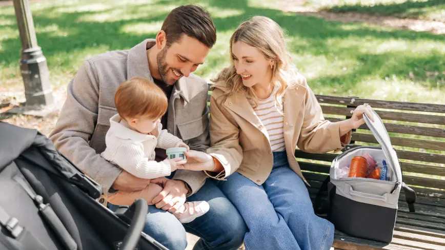 Parent handing child snack from Bevvy™ cooler