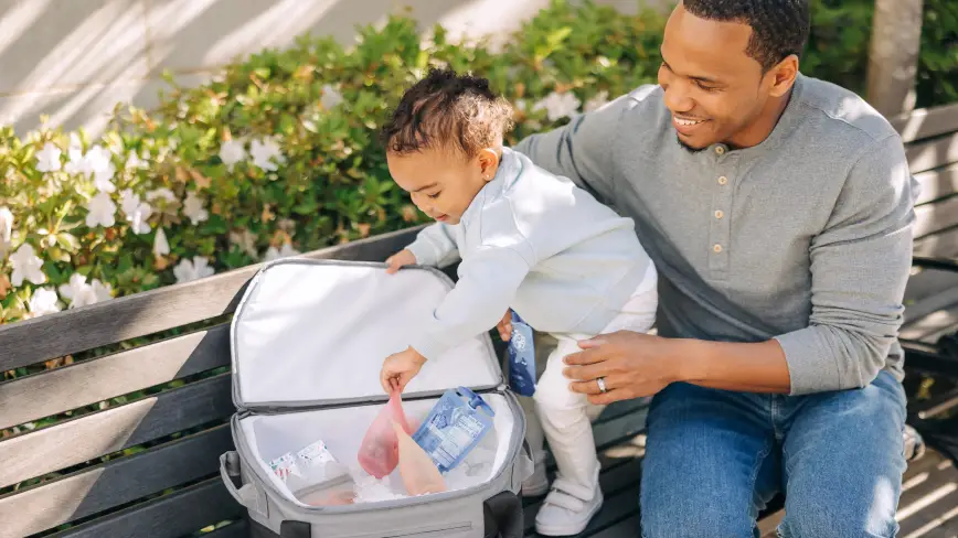 Child reaches for snack from Bevvy™ cooler