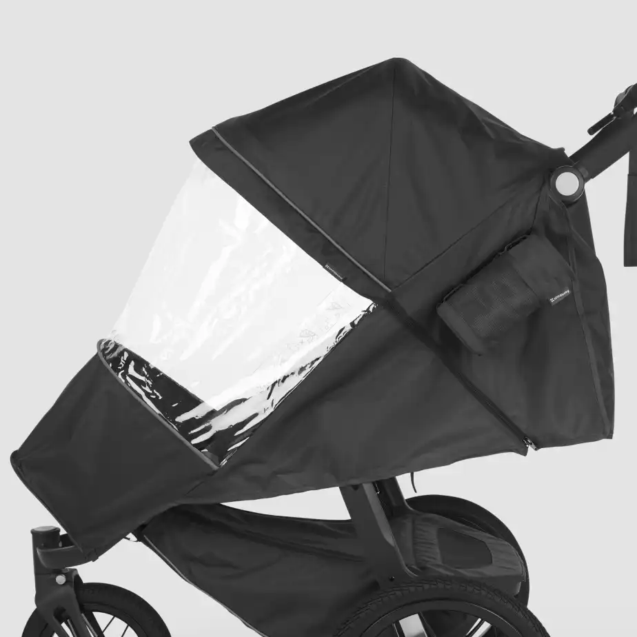 The Performance Rain Shield easily attaches to stroller frame and features reflective details for added visibility while strolling