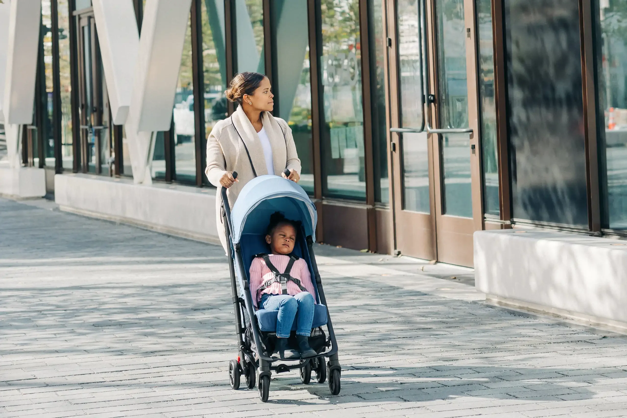 A child comfortably naps in the G-Luxe thanks to its heavy duty 55 lb child weight limit, adjustable footrest, extendable canopy, and one-handed reclining seat