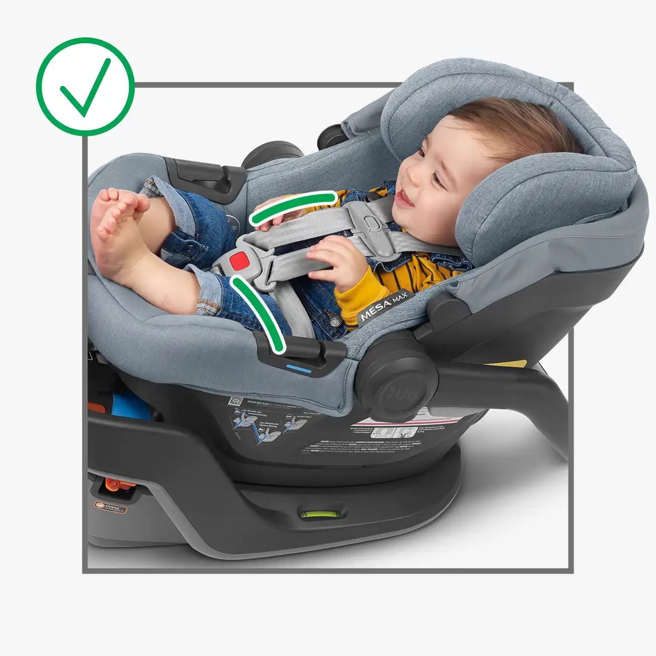 Correct harness position. Car seat is properly fitted to infant so that there is no webbing slack around torso or hip area indicating the harness has been properly tightened.