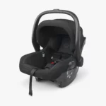 The Mesa V2 infant carrier (Jake) includes removable and washable seat fabrics that are free from flame-retardant chemicals, and a carry handle with a convenient stroller release button